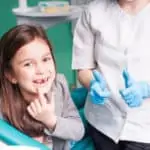 young girl in dental chair