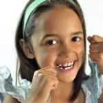 child flossing