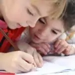 young kids doing homework